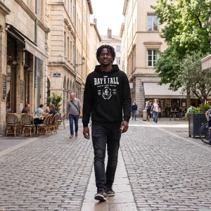 Young Senegalese man in Paris wearing a black Baye Fall hoodie with the Mame Cheikh Ibrahima Fall portrait